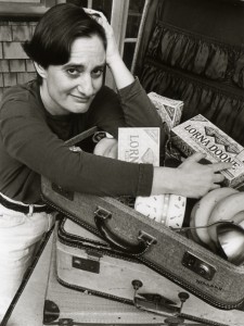 Deborah Hoffmann with her mother's suitcase (from "the Suitcase Period"), packed with Lorna Doone cookies.